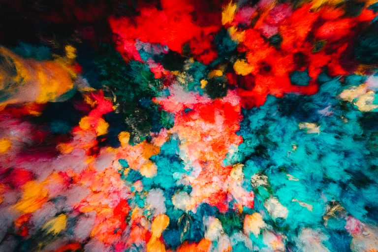 Colorful abstract art installation on a ceiling, showcasing a vibrant spectrum of hues.